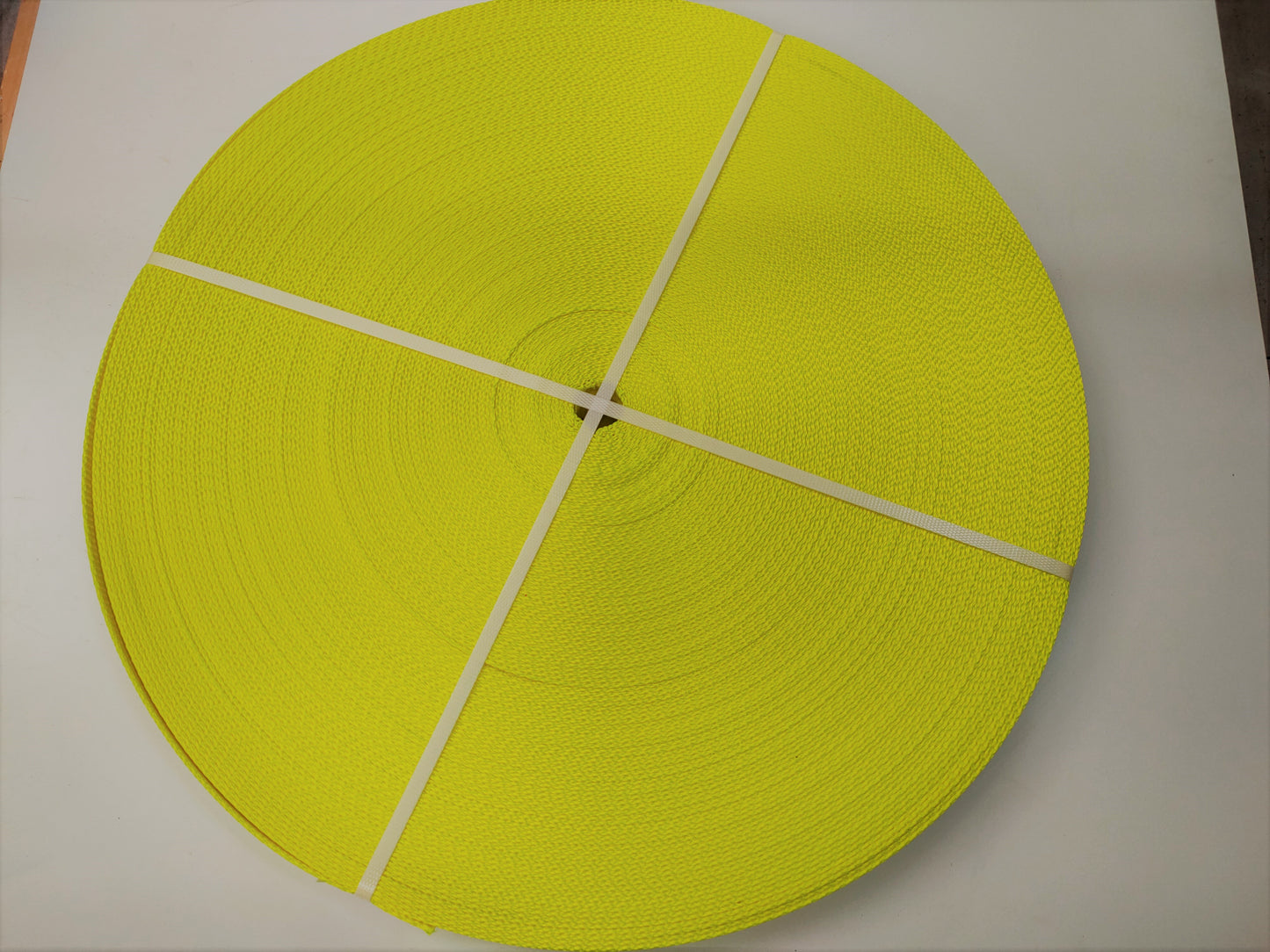 5t_5000kg_50mm_polyester_lashing_webbing_roll_hi_visibility_yellow_image_1